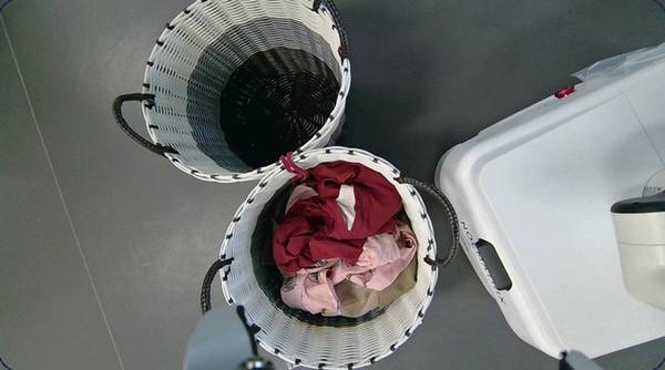 Laundry baskets with garments being sorted