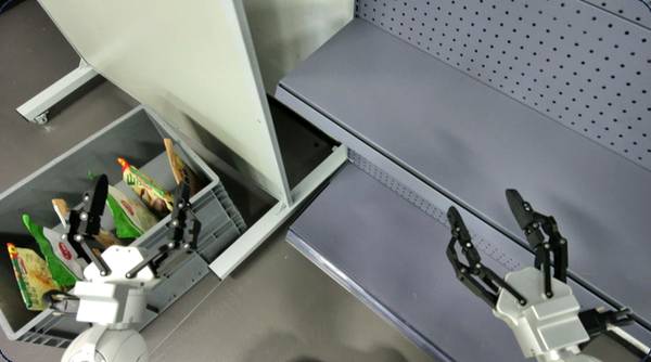 Robot restocking snacks from a tote onto a store shelf